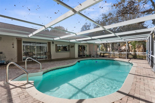 pool featuring a lanai and a patio