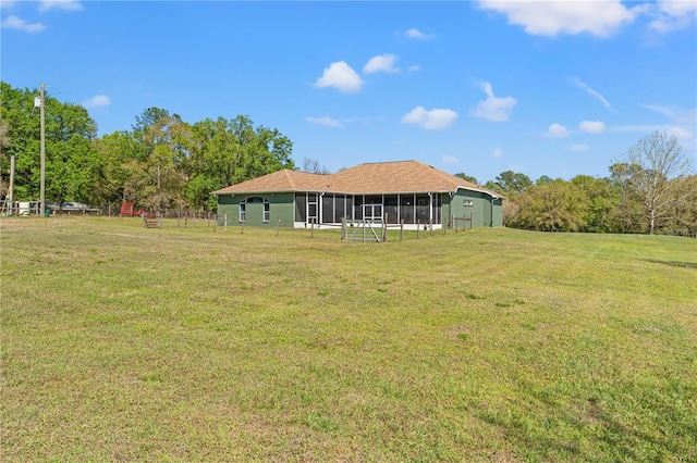 view of yard with a sunroom