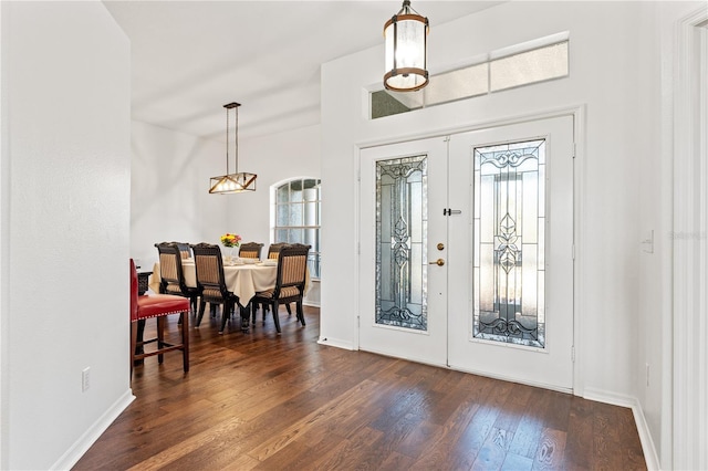 entryway featuring french doors, dark wood-style flooring, and baseboards