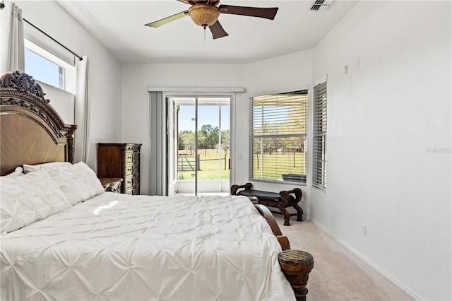 bedroom with access to exterior, light colored carpet, baseboards, and ceiling fan