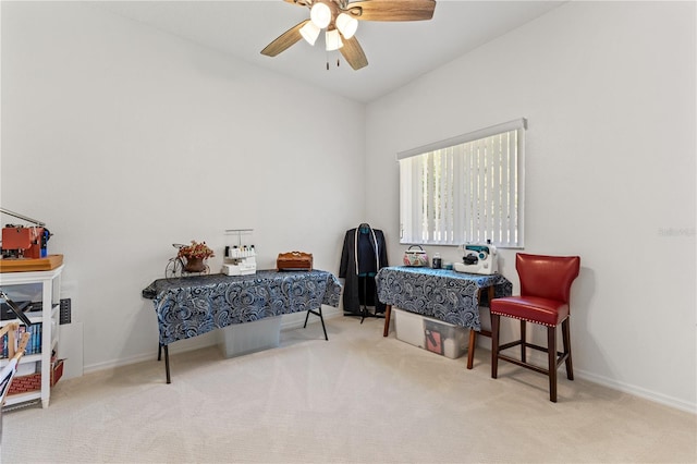 carpeted bedroom featuring baseboards and a ceiling fan