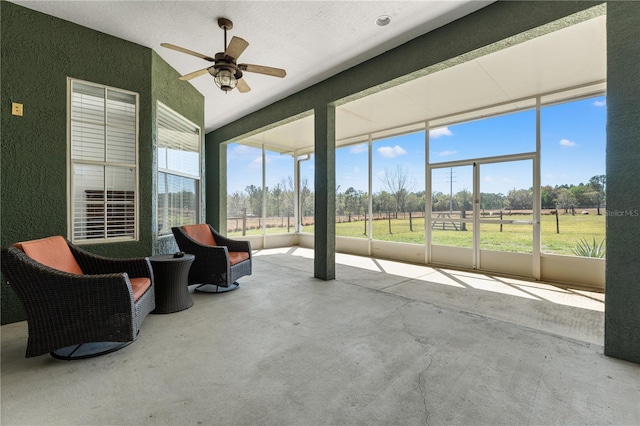 sunroom with a ceiling fan