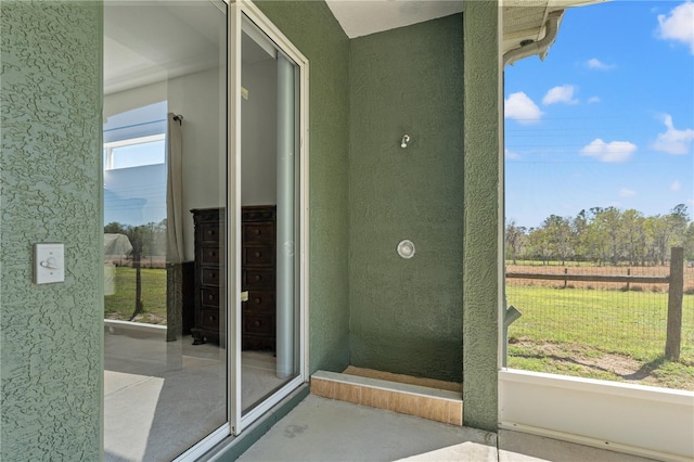 view of exterior entry with stucco siding