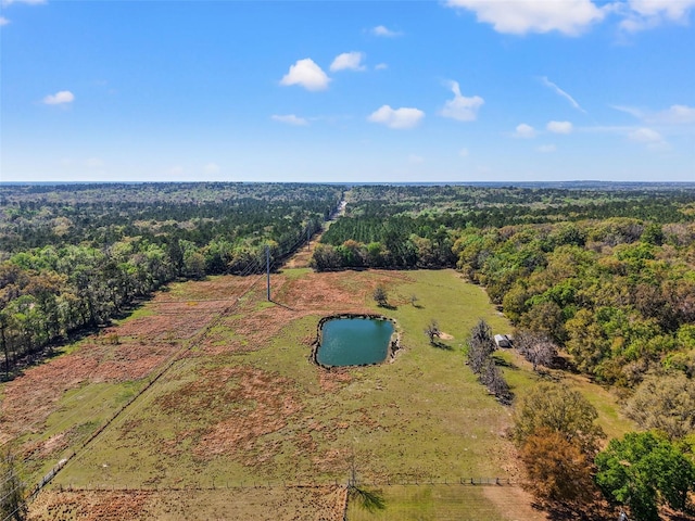 aerial view with a forest view and a water view