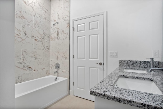 full bath with double vanity, tub / shower combination, and a sink