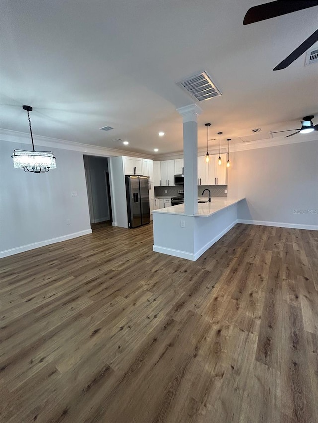 unfurnished living room with dark wood-style floors, a sink, recessed lighting, a ceiling fan, and crown molding