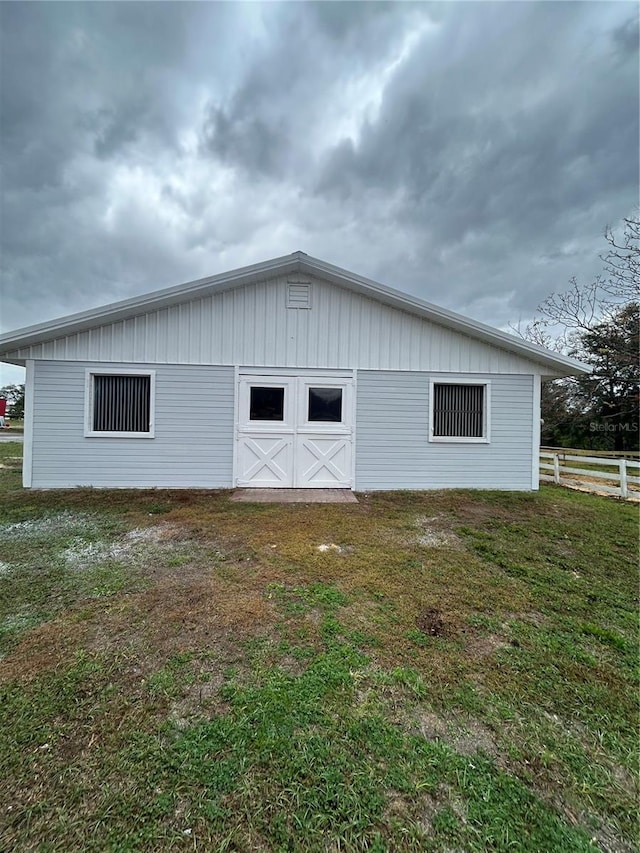 view of outdoor structure with fence