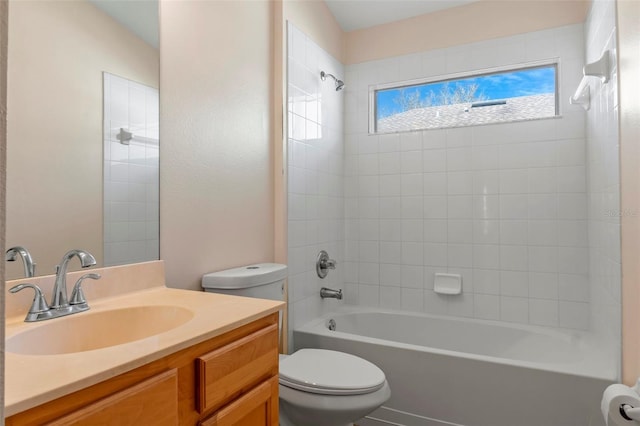 bathroom with shower / bathtub combination, vanity, and toilet