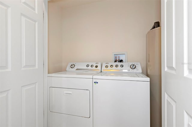 laundry room featuring laundry area and washing machine and clothes dryer