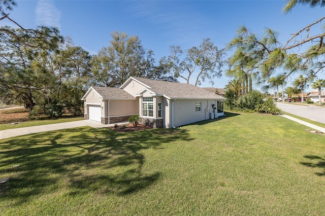 single story home with a garage, concrete driveway, stone siding, stucco siding, and a front yard