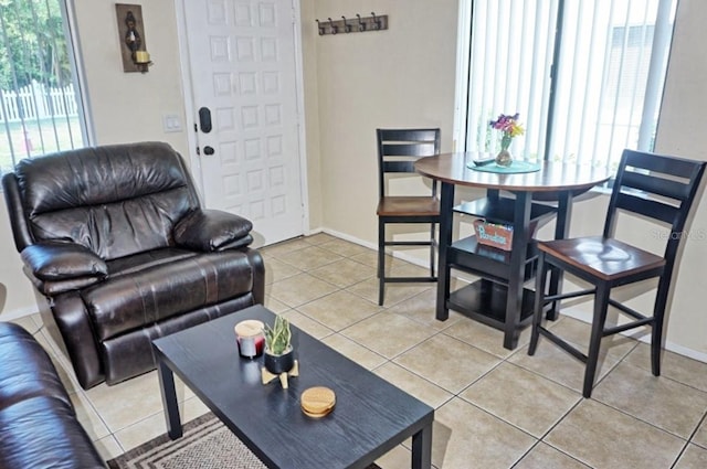 tiled living area with baseboards