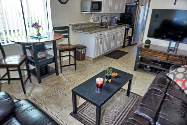 living room with light tile patterned floors