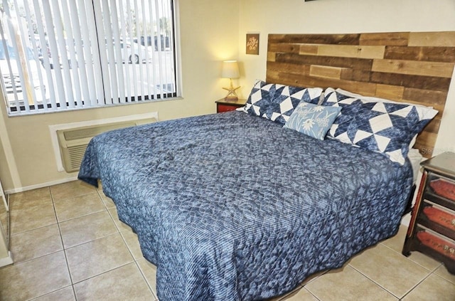 tiled bedroom with radiator and multiple windows