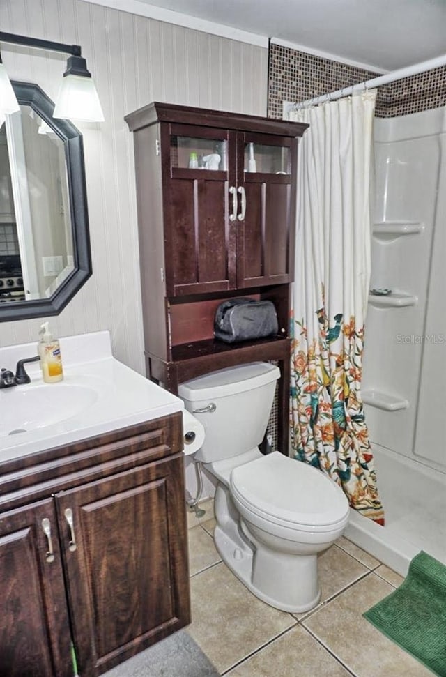 full bath featuring a stall shower, toilet, and tile patterned floors