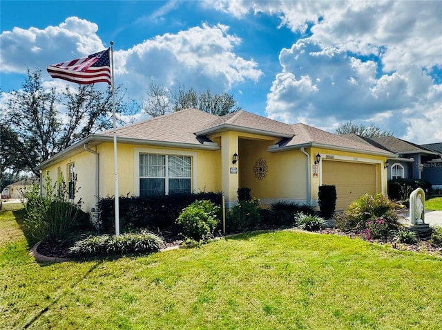 single story home featuring roof with shingles, an attached garage, a front lawn, and stucco siding