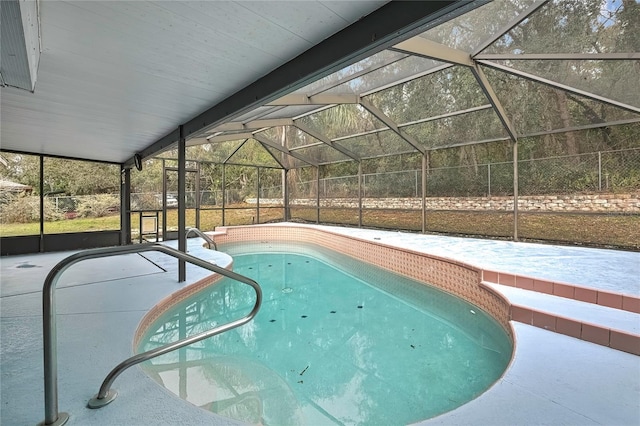 pool featuring a lanai and a patio