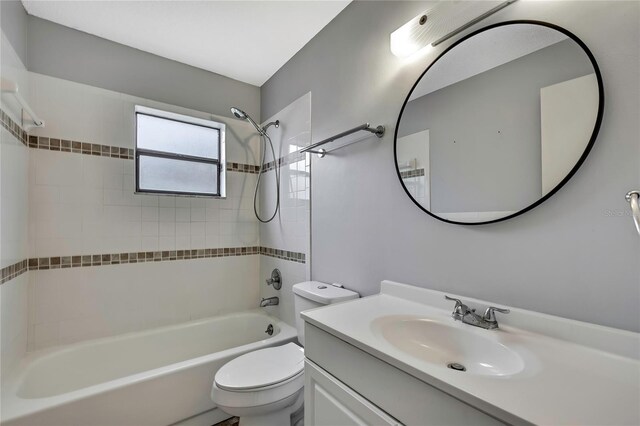 bathroom featuring toilet, shower / bath combination, and vanity