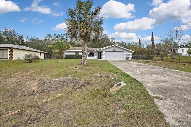 ranch-style house featuring a garage, concrete driveway, and a front yard