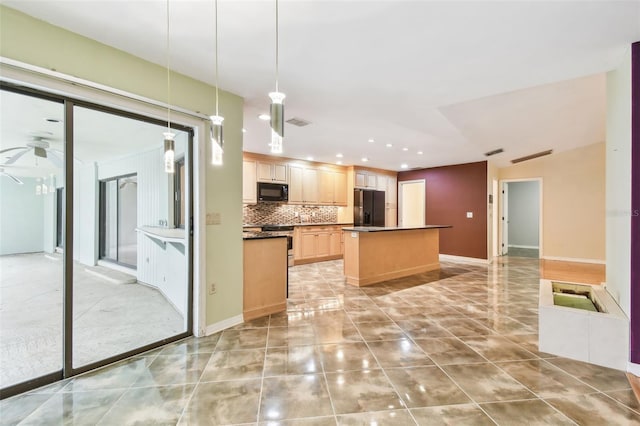 kitchen featuring visible vents, light brown cabinetry, a center island, black appliances, and tasteful backsplash