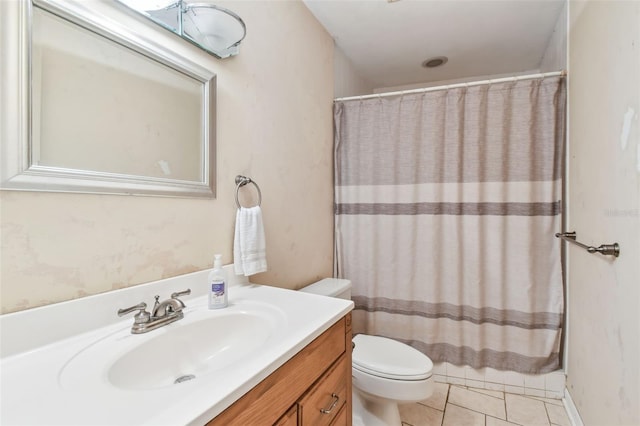 full bathroom featuring toilet, tile patterned flooring, and vanity