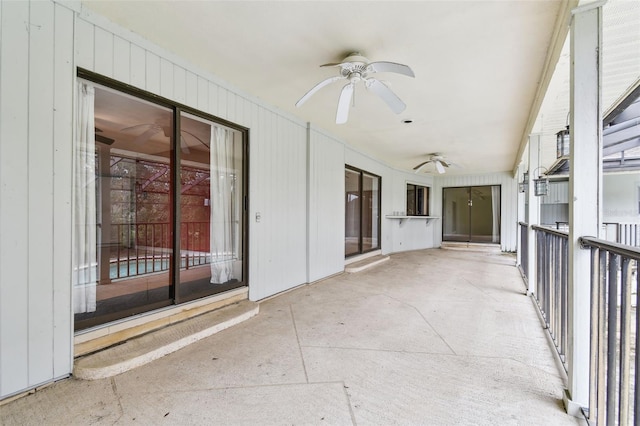 exterior space with a ceiling fan