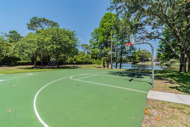 view of basketball court with a water view and community basketball court