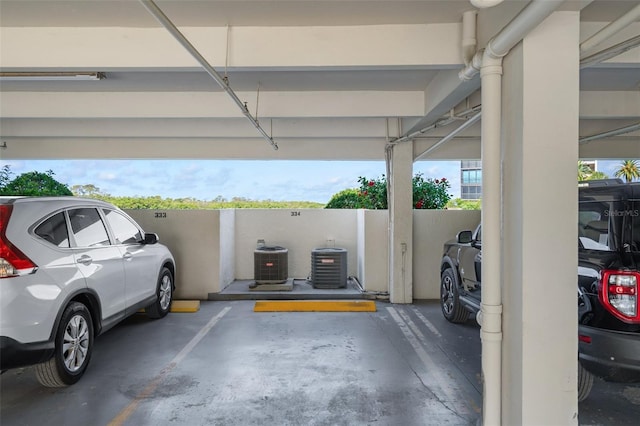 garage with covered parking and cooling unit