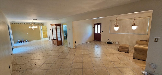 17932 Wendy Sue Ave, Hudson, FL 34667 - entrance foyer with a chandelier and light tile patterned floors