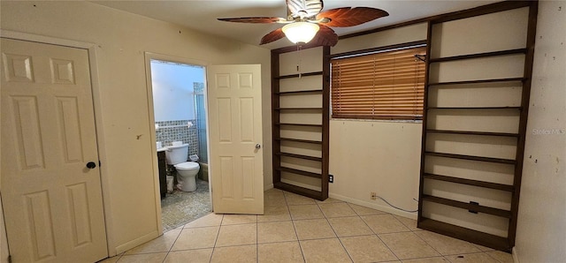 17932 Wendy Sue Ave, Hudson, FL 34667 - unfurnished bedroom with light tile patterned flooring and ensuite bathroom