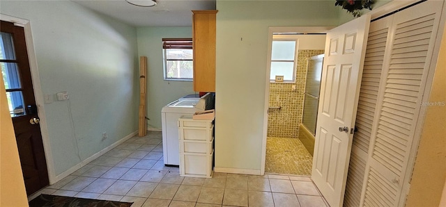 17932 Wendy Sue Ave, Hudson, FL 34667 - laundry room featuring light tile patterned floors, washer / clothes dryer, and cabinet space