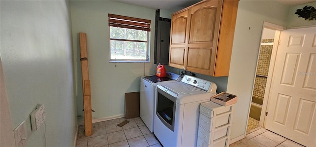 17932 Wendy Sue Ave, Hudson, FL 34667 - laundry area featuring cabinet space, separate washer and dryer, light tile patterned floors, and electric panel