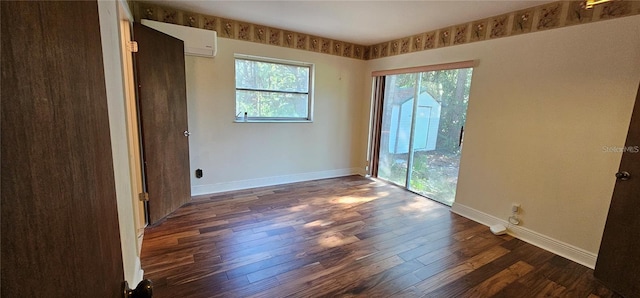 17932 Wendy Sue Ave, Hudson, FL 34667 - unfurnished bedroom featuring dark wood-style floors and a wall unit AC
