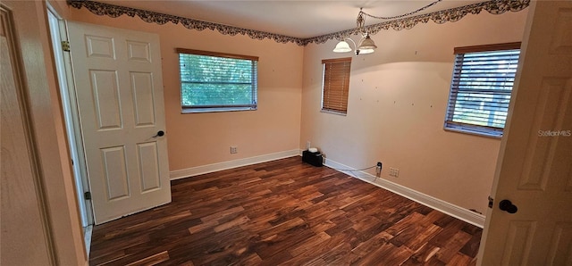 17932 Wendy Sue Ave, Hudson, FL 34667 - spare room with plenty of natural light and dark wood-style floors