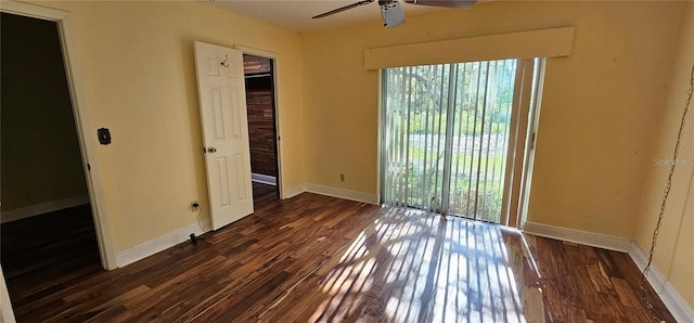 17932 Wendy Sue Ave, Hudson, FL 34667 - unfurnished room featuring dark wood-style floors and a ceiling fan