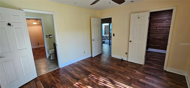 17932 Wendy Sue Ave, Hudson, FL 34667 - unfurnished bedroom with dark wood finished floors, ensuite bathroom, a ceiling fan, and a spacious closet