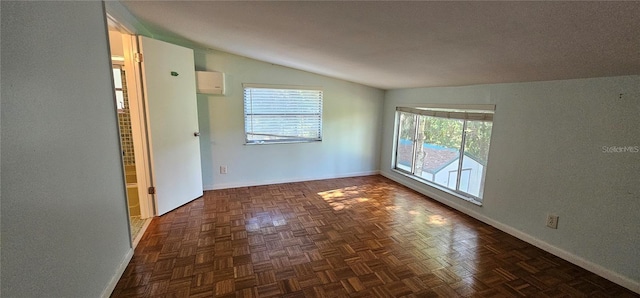 17932 Wendy Sue Ave, Hudson, FL 34667 - empty room with vaulted ceiling and a wall mounted AC