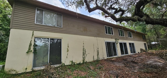 17932 Wendy Sue Ave, Hudson, FL 34667 - back of house with stucco siding