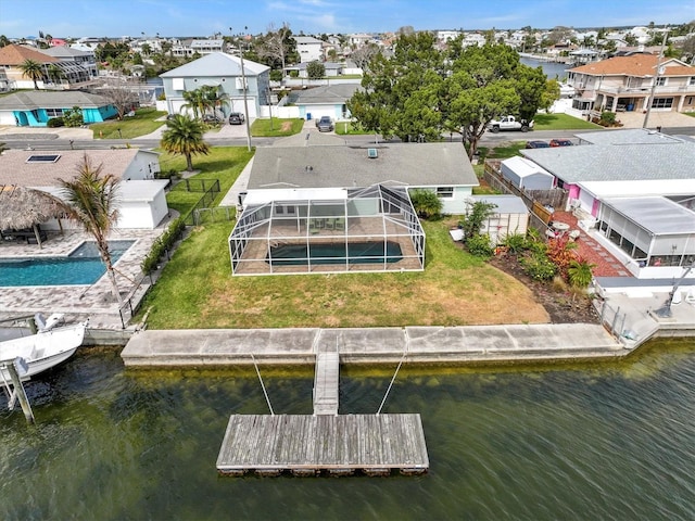 bird's eye view featuring a residential view and a water view