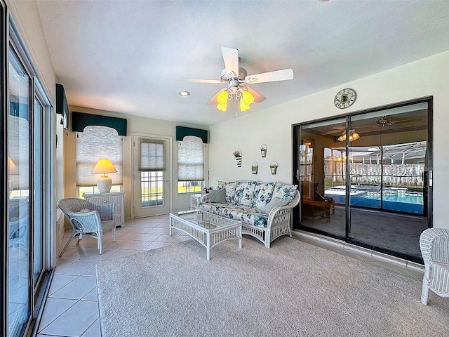 sunroom featuring ceiling fan