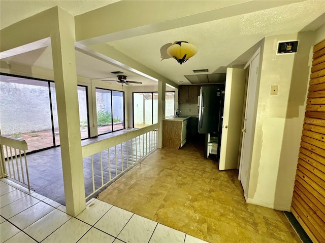 corridor with a textured ceiling