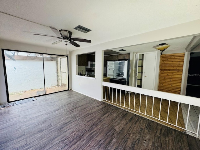 interior space featuring visible vents and ceiling fan