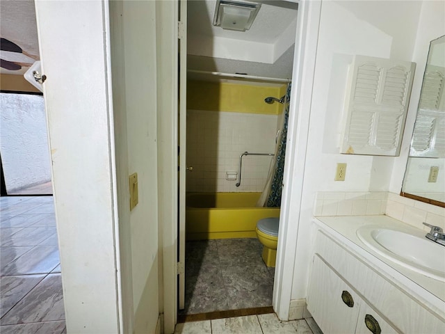 full bathroom featuring vanity, toilet, and shower / tub combo with curtain