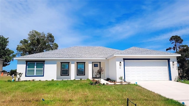 single story home with driveway, a front yard, an attached garage, and stucco siding