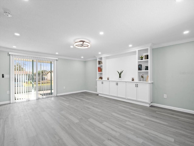 unfurnished living room with ornamental molding, recessed lighting, wood finished floors, and baseboards