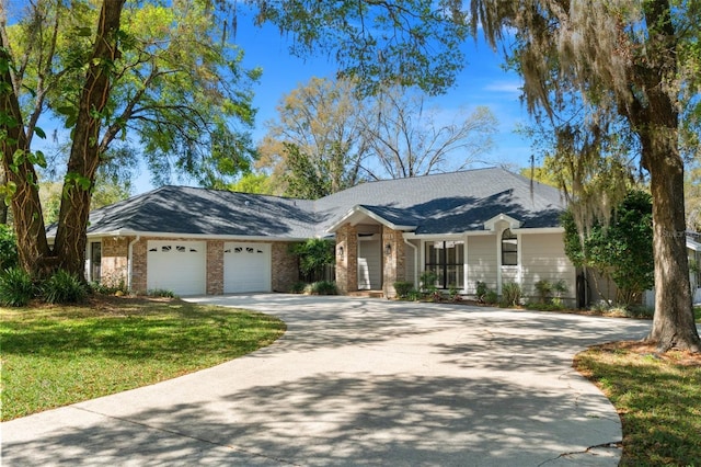 ranch-style home featuring brick siding, driveway, an attached garage, and a front lawn