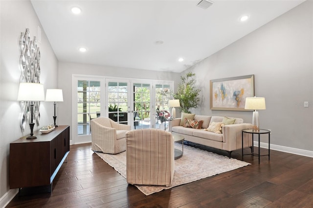 living room featuring visible vents, dark wood finished floors, french doors, baseboards, and vaulted ceiling