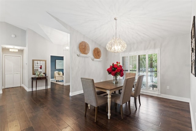 dining space featuring a chandelier, baseboards, dark wood-type flooring, and lofted ceiling