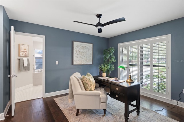 office area with a ceiling fan, baseboards, and hardwood / wood-style floors