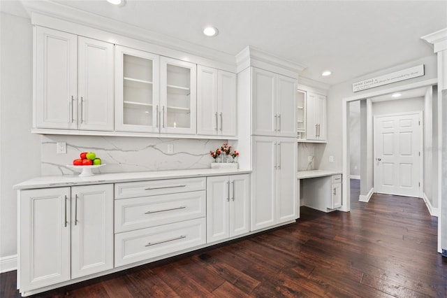 bar featuring dark wood finished floors, recessed lighting, tasteful backsplash, and baseboards