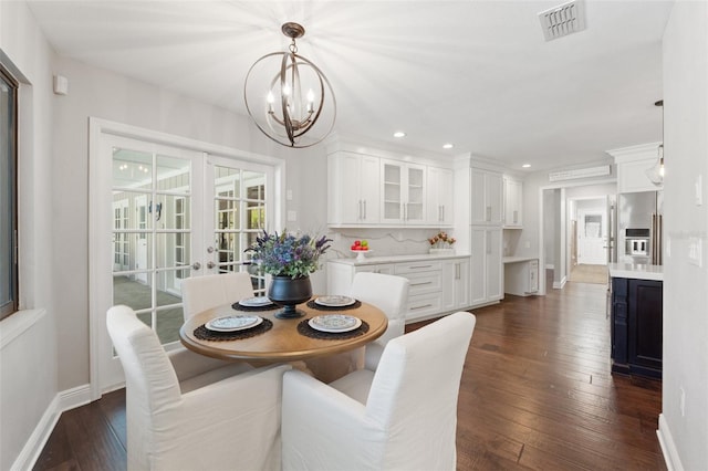 dining space featuring visible vents, baseboards, dark wood-style floors, and french doors